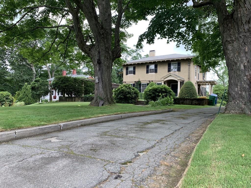 75 Pleasant Street Newton, MA 02459 - Photo 13 of 14 a front view of a house with a yard
