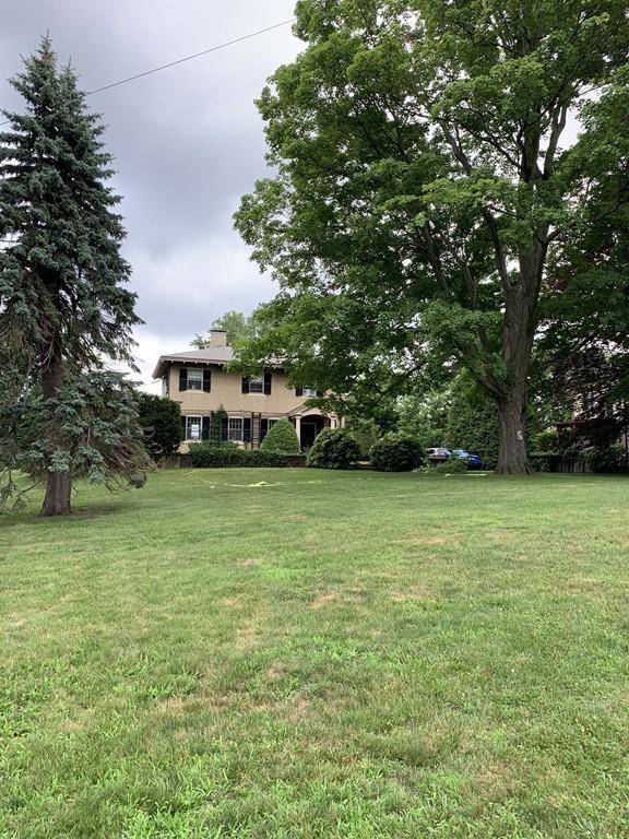 75 Pleasant Street Newton, MA 02459 - Photo 4 of 14 a view of a field of grass and trees