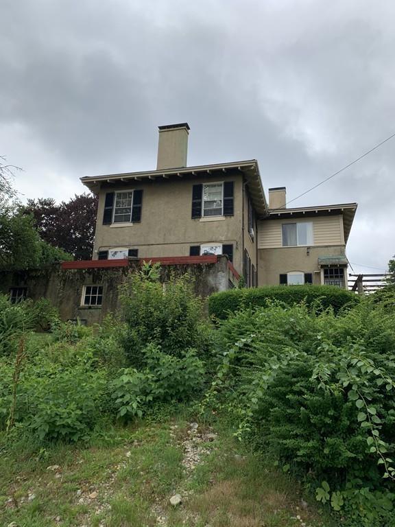 75 Pleasant Street Newton, MA 02459 - Photo 10 of 14 a front view of a house with garden