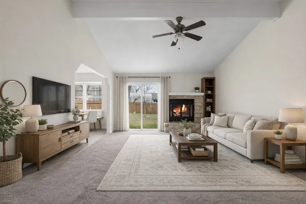 a living room with furniture fireplace and a flat screen tv
