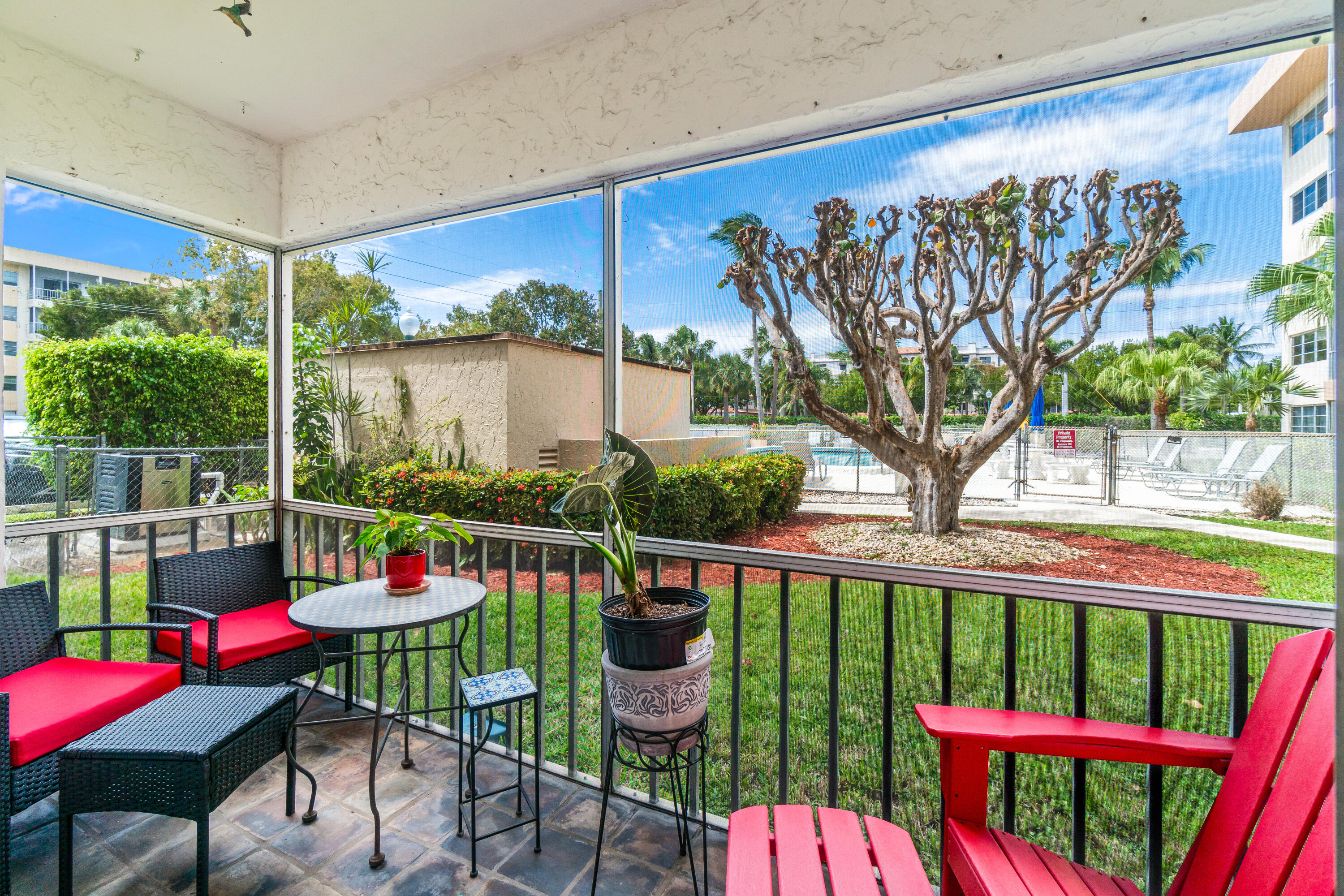 290 West Palmetto Park Road, Unit 114 Boca Raton, FL 33432 - Photo 11 of 25 a view of a chairs and table in patio