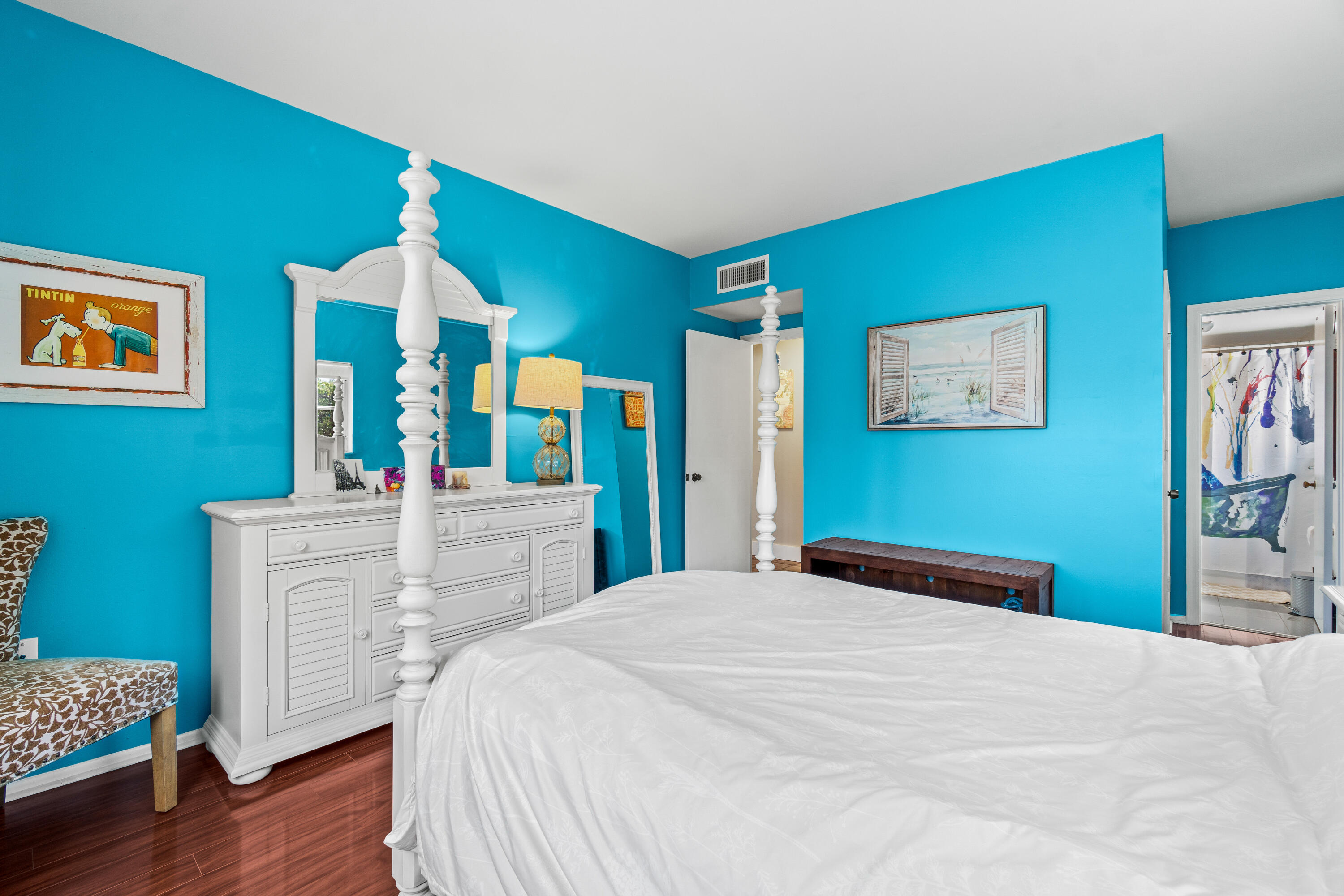 290 West Palmetto Park Road, Unit 114 Boca Raton, FL 33432 - Photo 15 of 25 a bedroom with a bed and a dresser