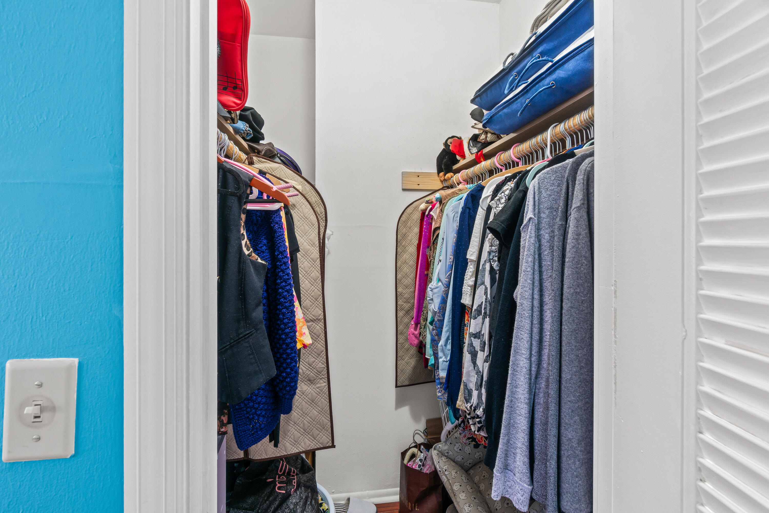 290 West Palmetto Park Road, Unit 114 Boca Raton, FL 33432 - Photo 16 of 25 a view of walk in closet with clothes