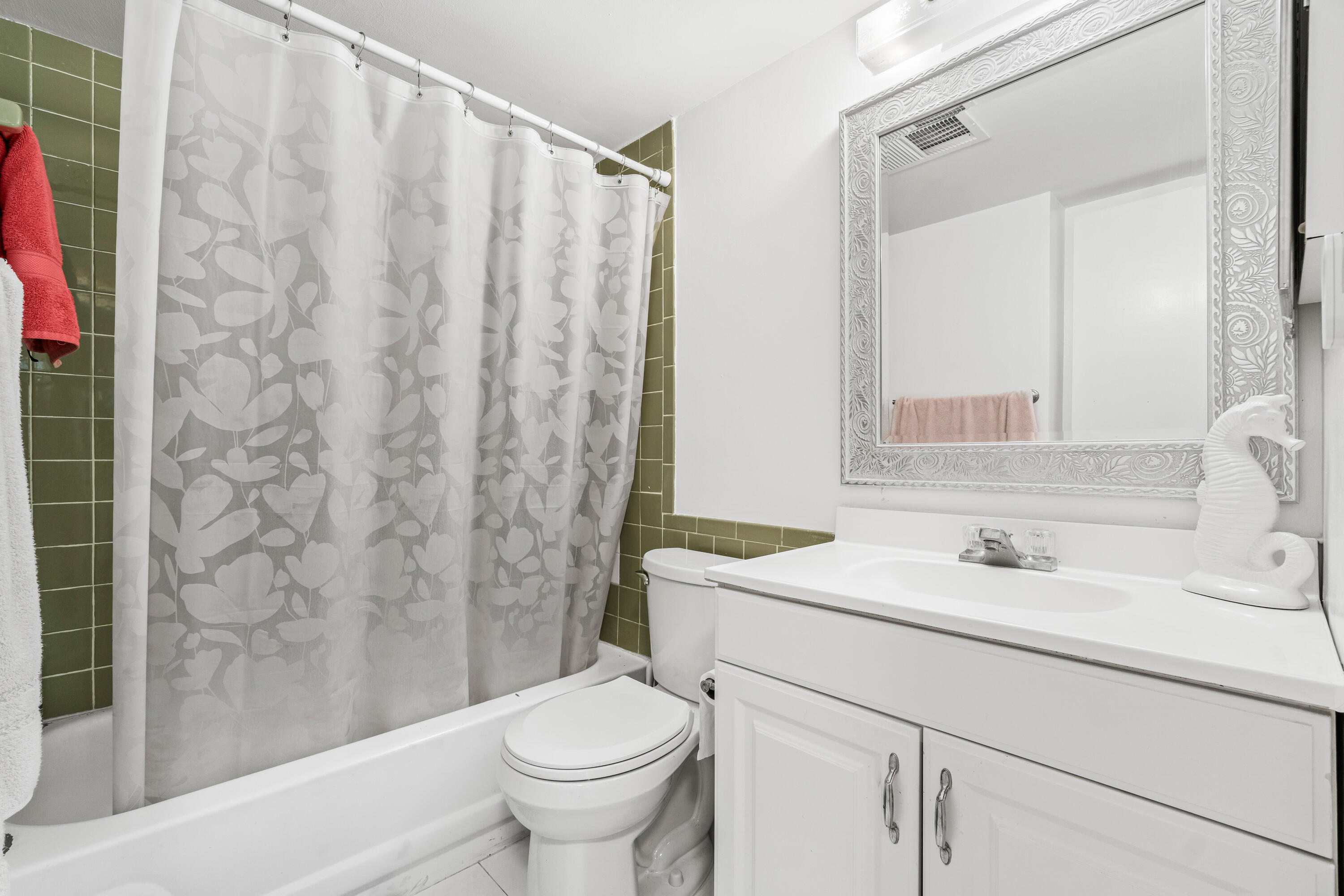 290 West Palmetto Park Road, Unit 114 Boca Raton, FL 33432 - Photo 19 of 25 a bathroom with a sink toilet and shower