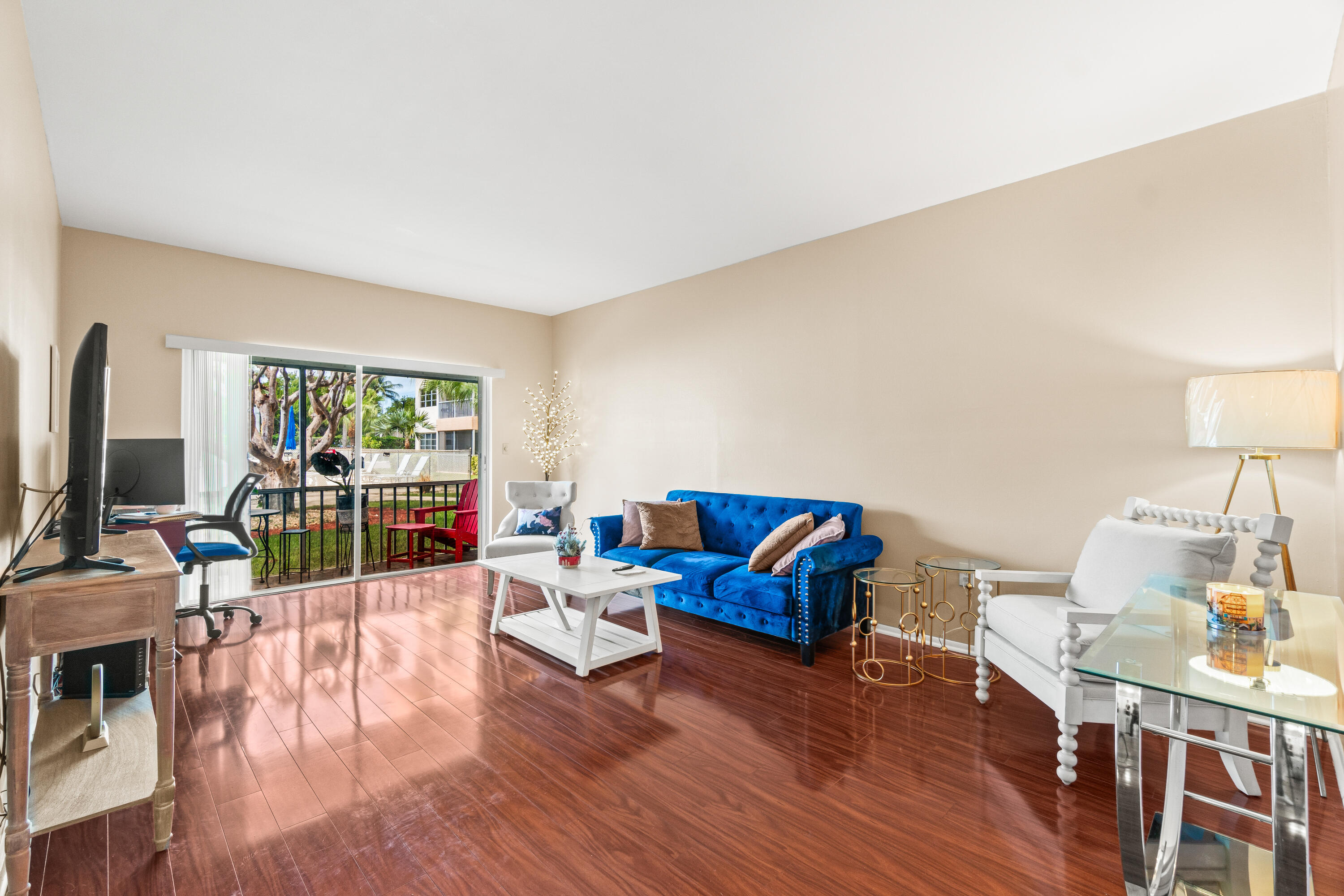 290 West Palmetto Park Road, Unit 114 Boca Raton, FL 33432 - Photo 10 of 25 a living room with fireplace furniture and a wooden floor