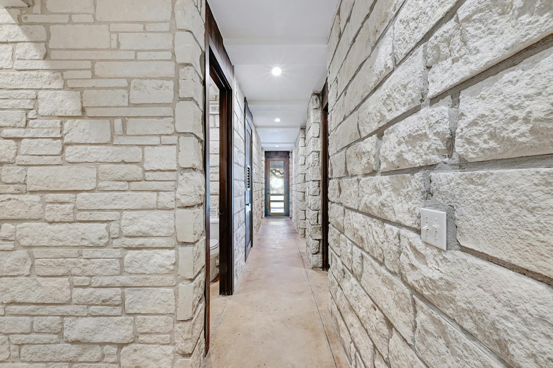 6021 Circle J Road Marble Falls, TX 78654 - Photo 13 of 39 Hall featuring concrete flooring and recessed lighting
