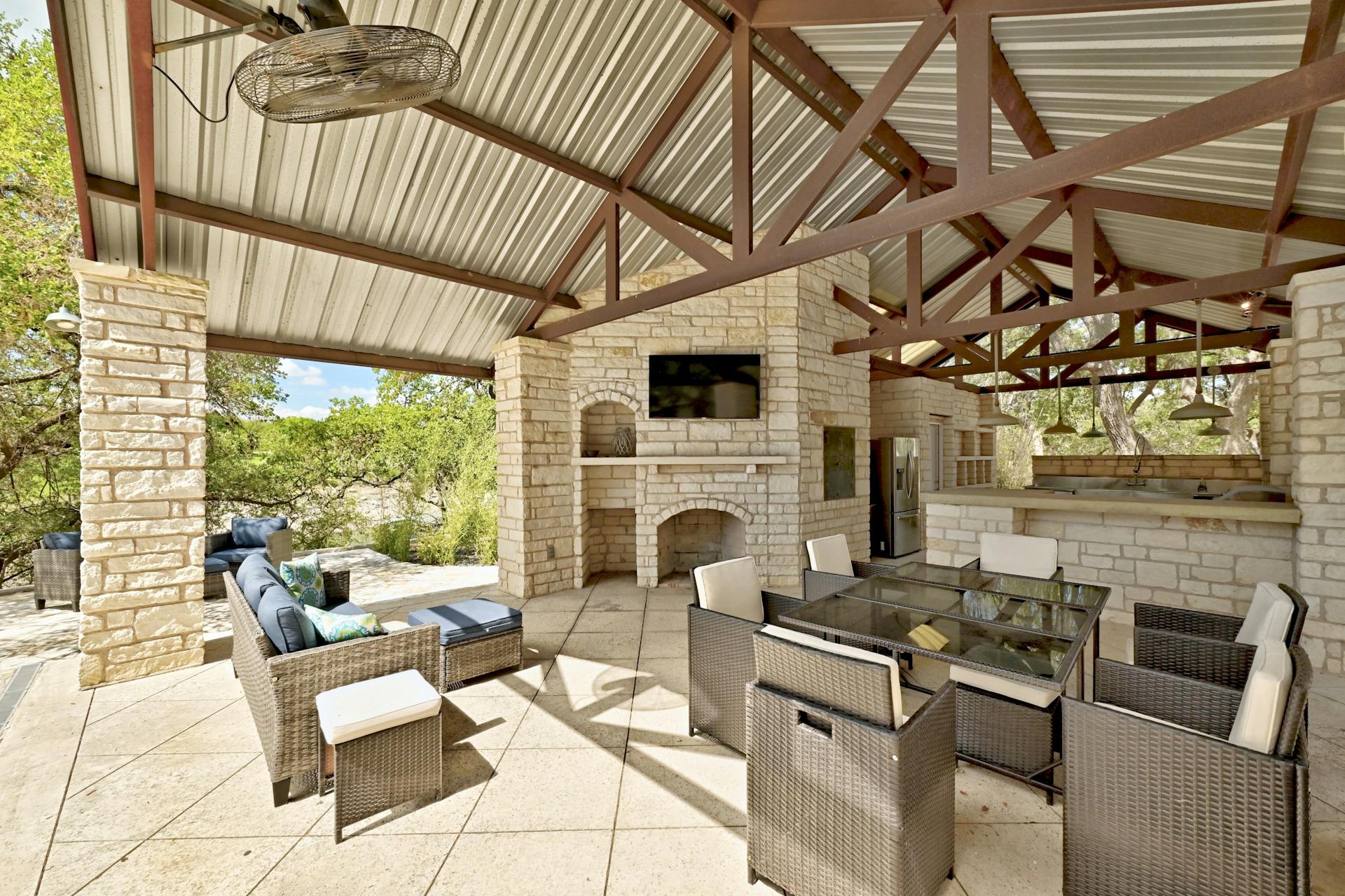 6021 Circle J Road Marble Falls, TX 78654 - Photo 16 of 39 View of patio / terrace featuring an outdoor stone fireplace and outdoor lounge area
