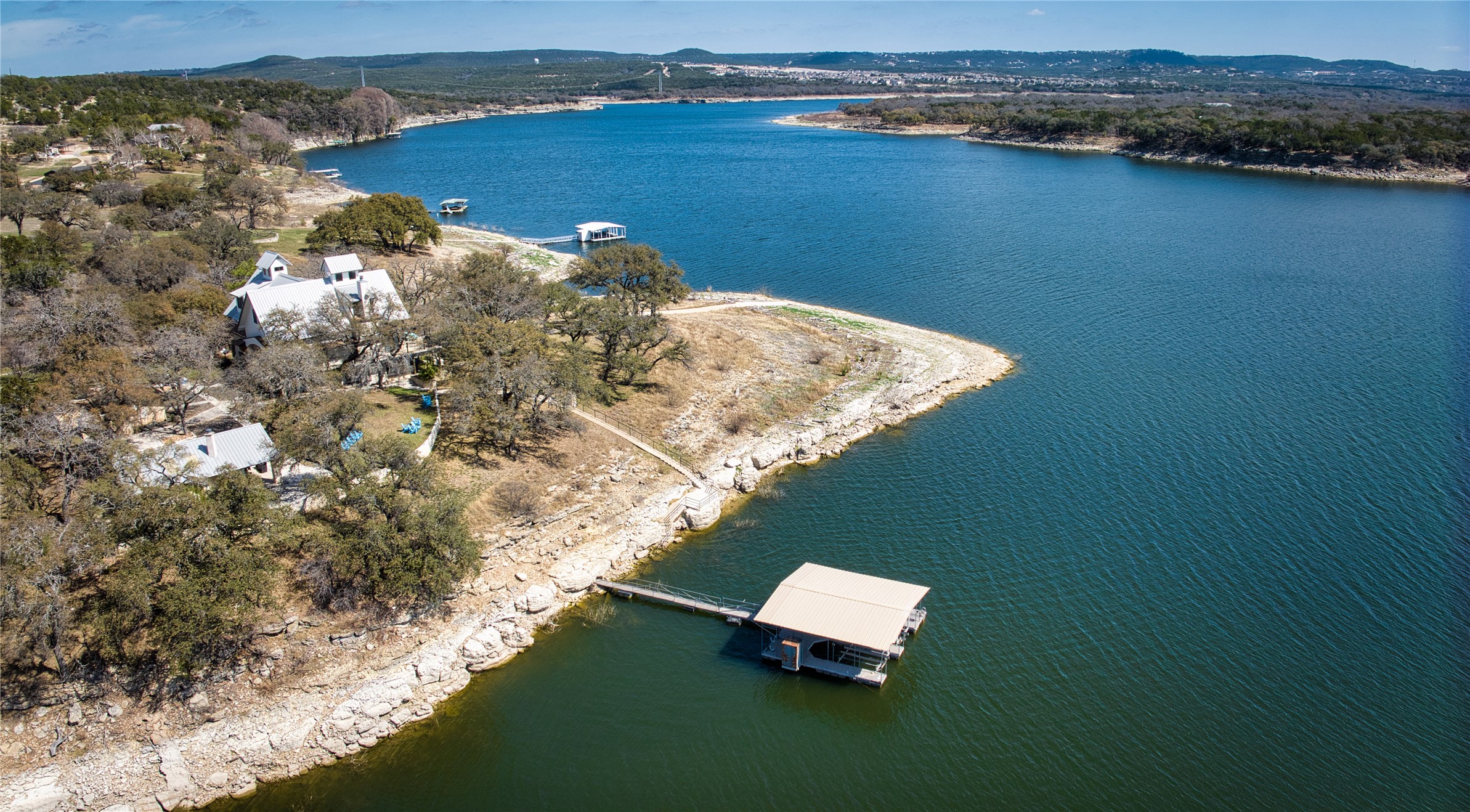 6021 Circle J Road Marble Falls, TX 78654 - Photo 2 of 39 Drone / aerial view of a water and mountain view