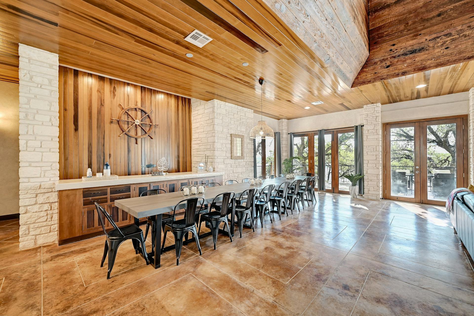 6021 Circle J Road Marble Falls, TX 78654 - Photo 24 of 39 Dining room with french doors, wood ceiling, and wooden walls