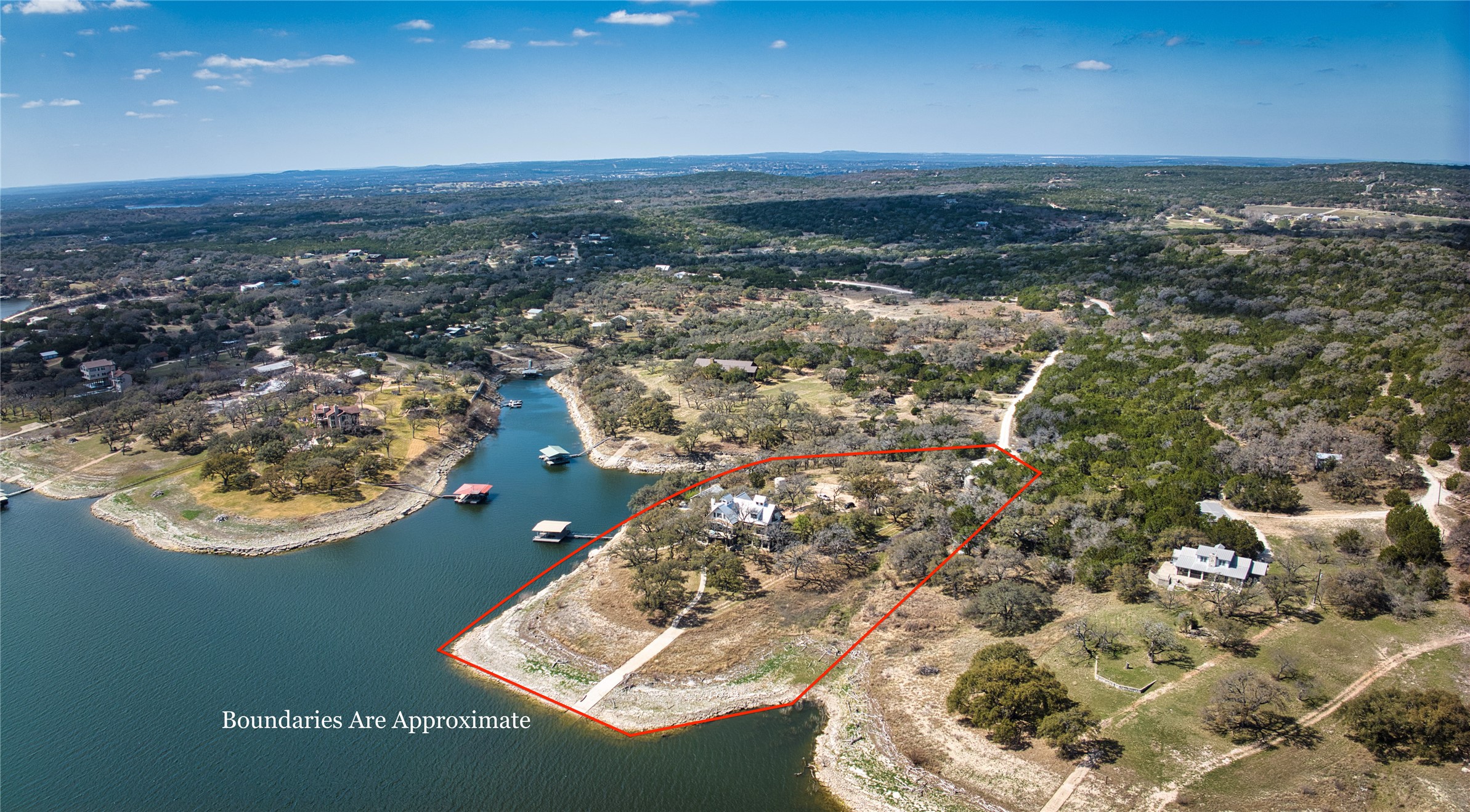6021 Circle J Road Marble Falls, TX 78654 - Photo 4 of 39 Aerial view of property and surrounding area featuring property parcel outlined