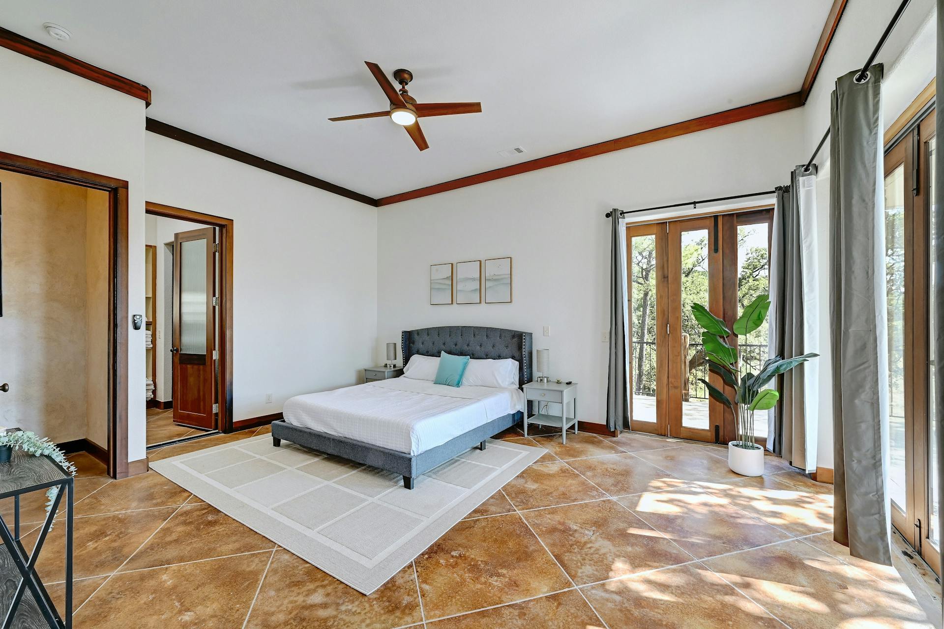 6021 Circle J Road Marble Falls, TX 78654 - Photo 10 of 39 Bedroom featuring ornamental molding, a ceiling fan, access to outside, and french doors