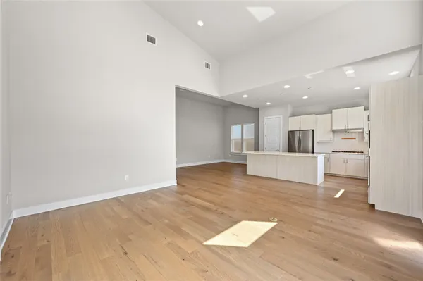 a view of kitchen with wooden floor