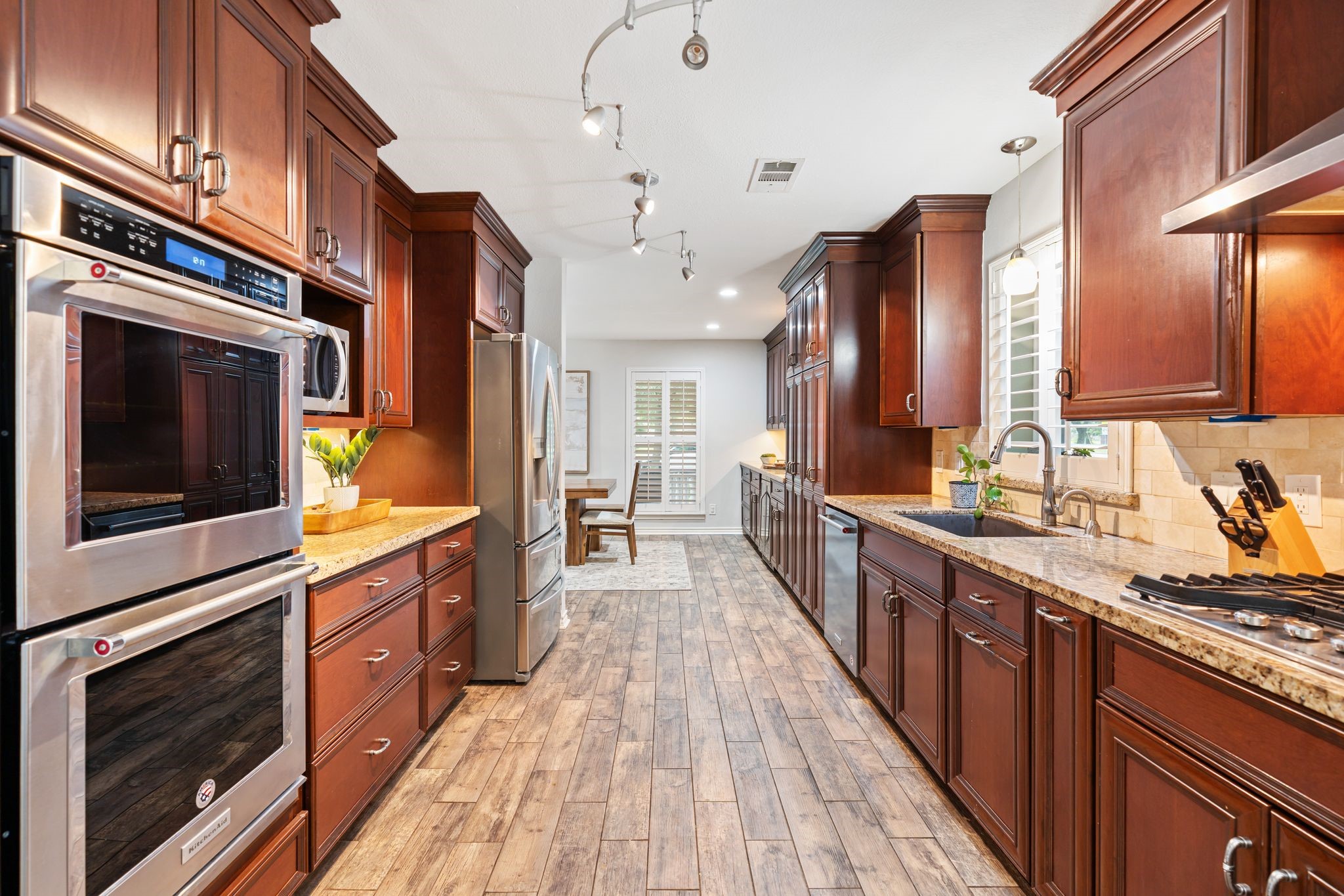 5658 Cartagena Street Houston, TX 77035 - Photo 10 of 33 The gourmet kitchen is equipped with high end appliances, a microwave nook and coffee bar.