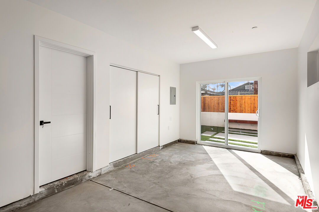 5464 Geer Street Los Angeles, CA 90016 - Photo 17 of 21 a view of an empty room with wooden floor and a window