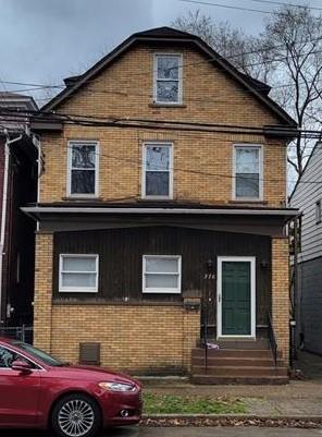 276 13th Street Ambridge, PA 15003 - Photo 1 of 25 a front view of a house with parking space
