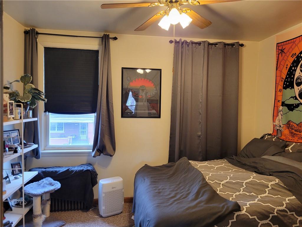 276 13th Street Ambridge, PA 15003 - Photo 17 of 25 a bedroom with a bed and a dresser in it