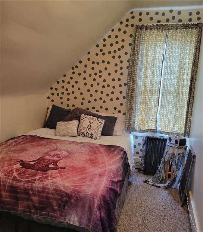 276 13th Street Ambridge, PA 15003 - Photo 20 of 25 a bedroom with a bed and a window