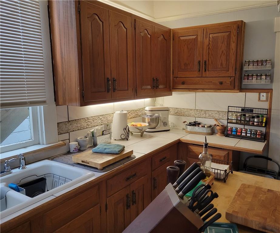 276 13th Street Ambridge, PA 15003 - Photo 9 of 25 a kitchen with a sink and cabinets