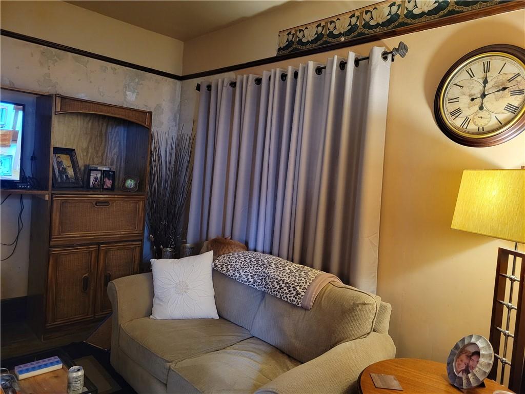 276 13th Street Ambridge, PA 15003 - Photo 10 of 25 a living room with furniture and a window