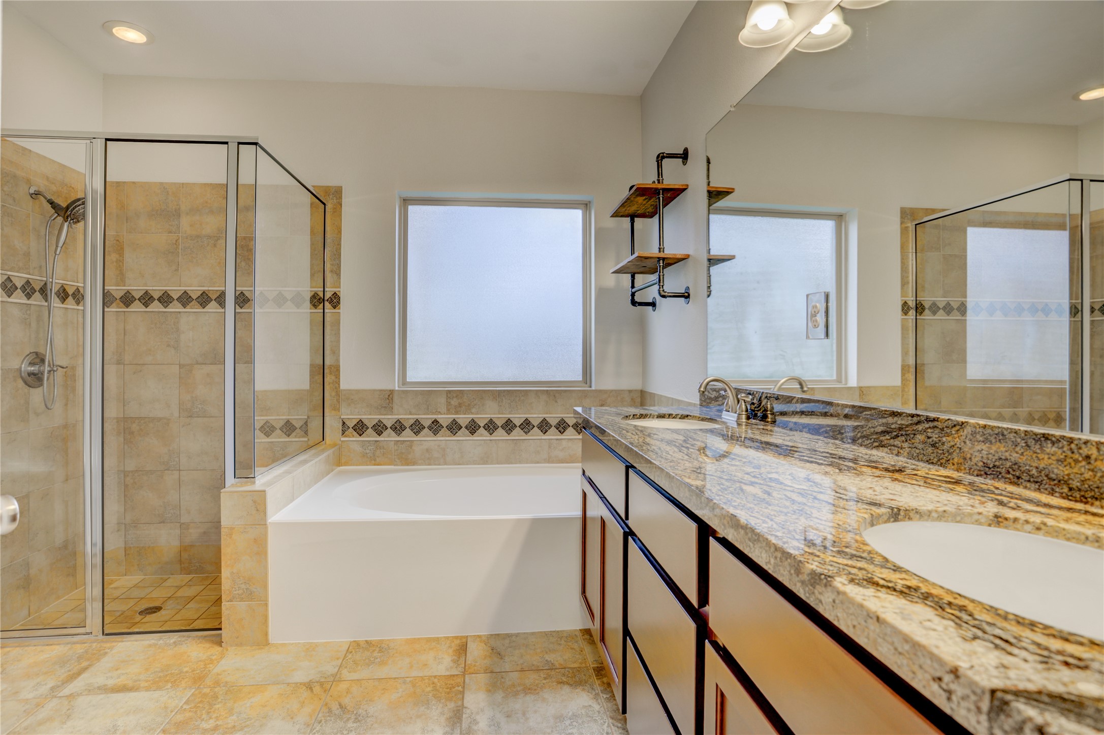 3002 Currant Drive Manvel, TX 77578 - Photo 23 of 43 a bathroom with a granite countertop tub sink and mirror