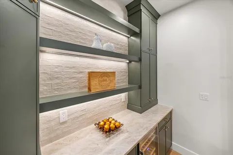 a bathroom with a sink a toilet a mirror and shower