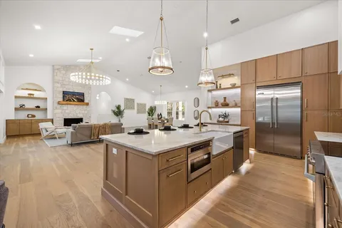 a spacious bathroom with a double vanity sink toilet and a tub