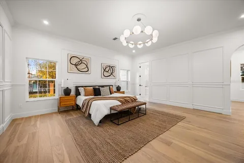 a bathroom with a sink toilet and mirror
