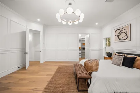 a view of a dining room with furniture and a large window