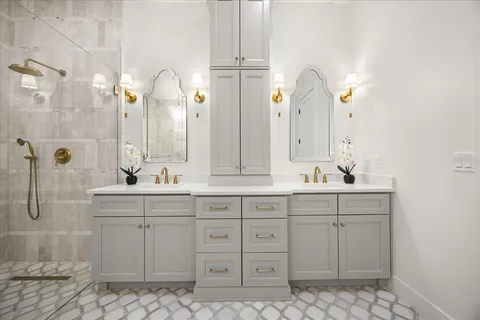 a bathroom with a toilet a sink and mirror