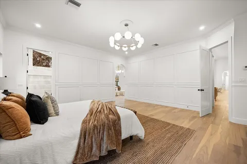 a living room with patio furniture and a large window