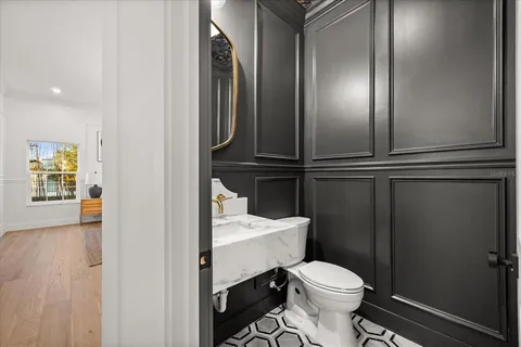 a view of swimming pool with outdoor seating and plants