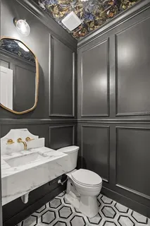 a view of a patio with couches table and chairs and potted plants