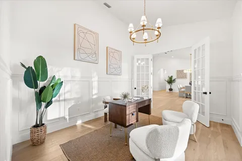 a view of a house with swimming pool and sitting area