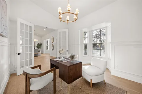 a view of a brick house with many windows and a table