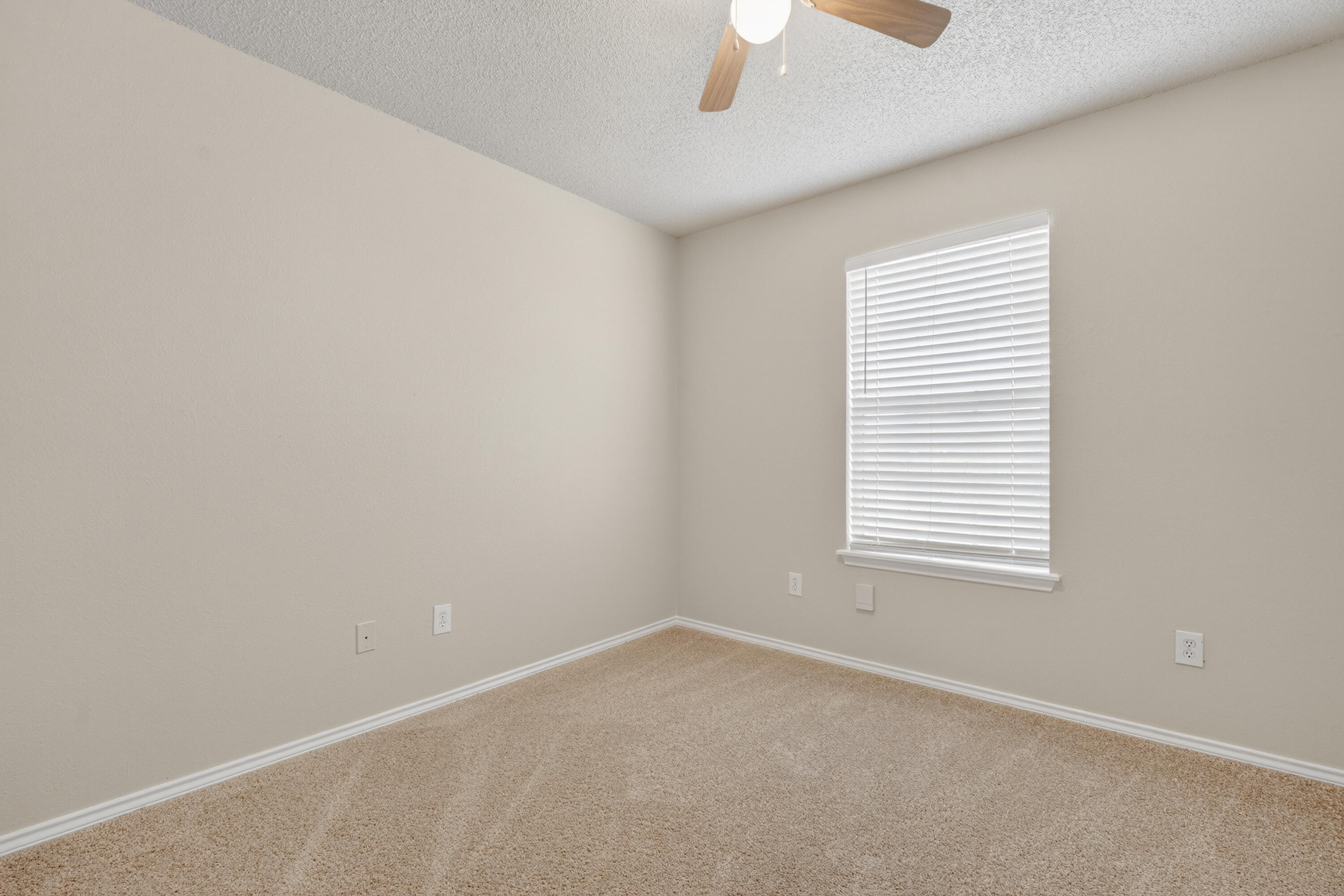 1805 75th Street Lubbock, TX 79423 - Photo 12 of 20 an empty room with a window