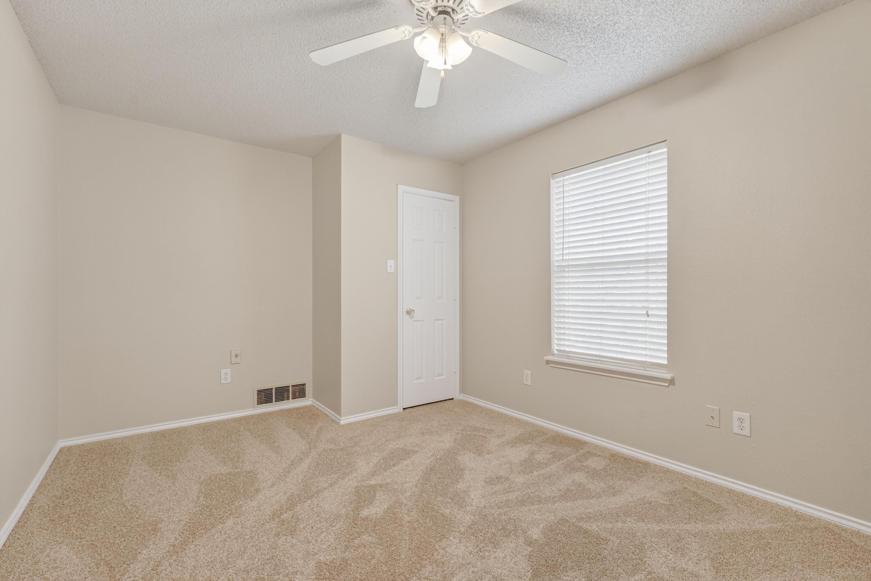 1805 75th Street Lubbock, TX 79423 - Photo 15 of 20 a view of an empty room with a window