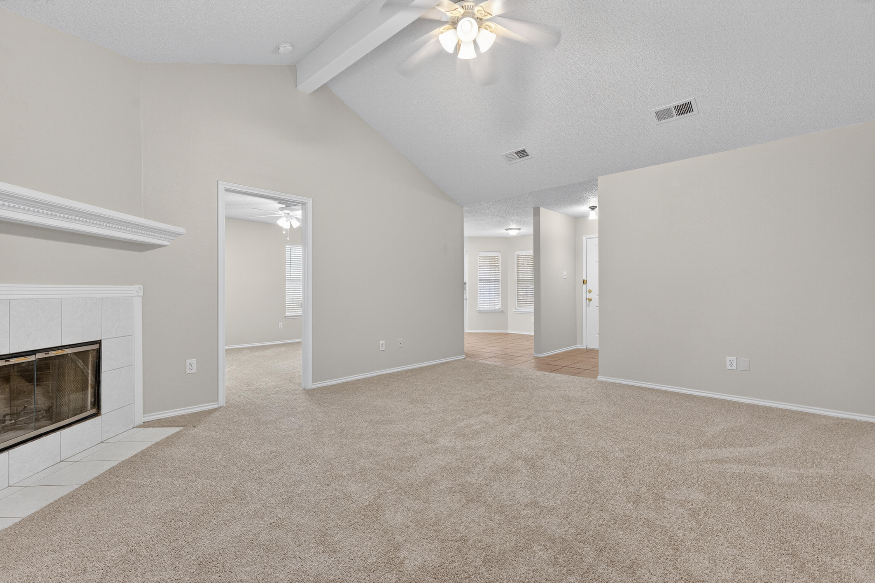 1805 75th Street Lubbock, TX 79423 - Photo 4 of 20 a view of an empty room with a fireplace