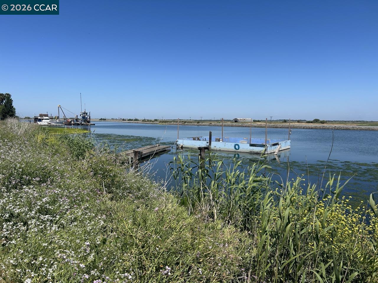 0 Bradford Island Road Bethel Island, CA 94511 - Photo 2 of 9 a view of a lake with houses in back