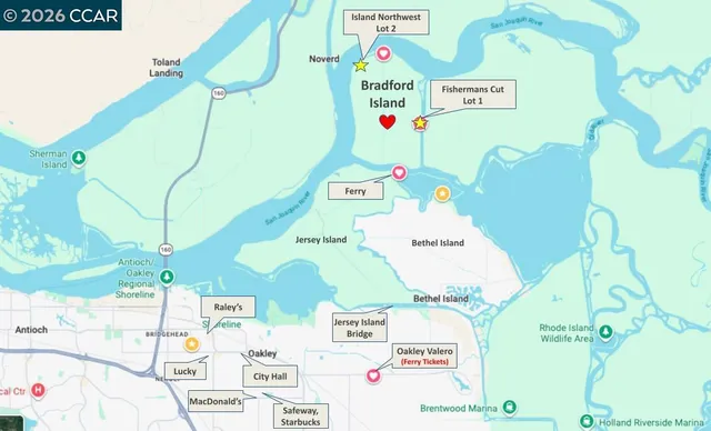 a view of a lake with houses in the back