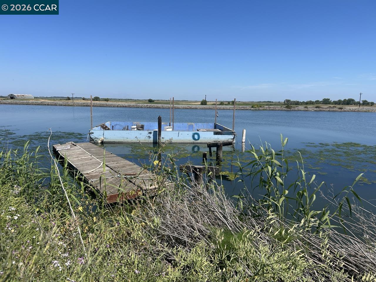 0 Bradford Island Road Bethel Island, CA 94511 - Photo 5 of 9 a view of a lake with houses in the back