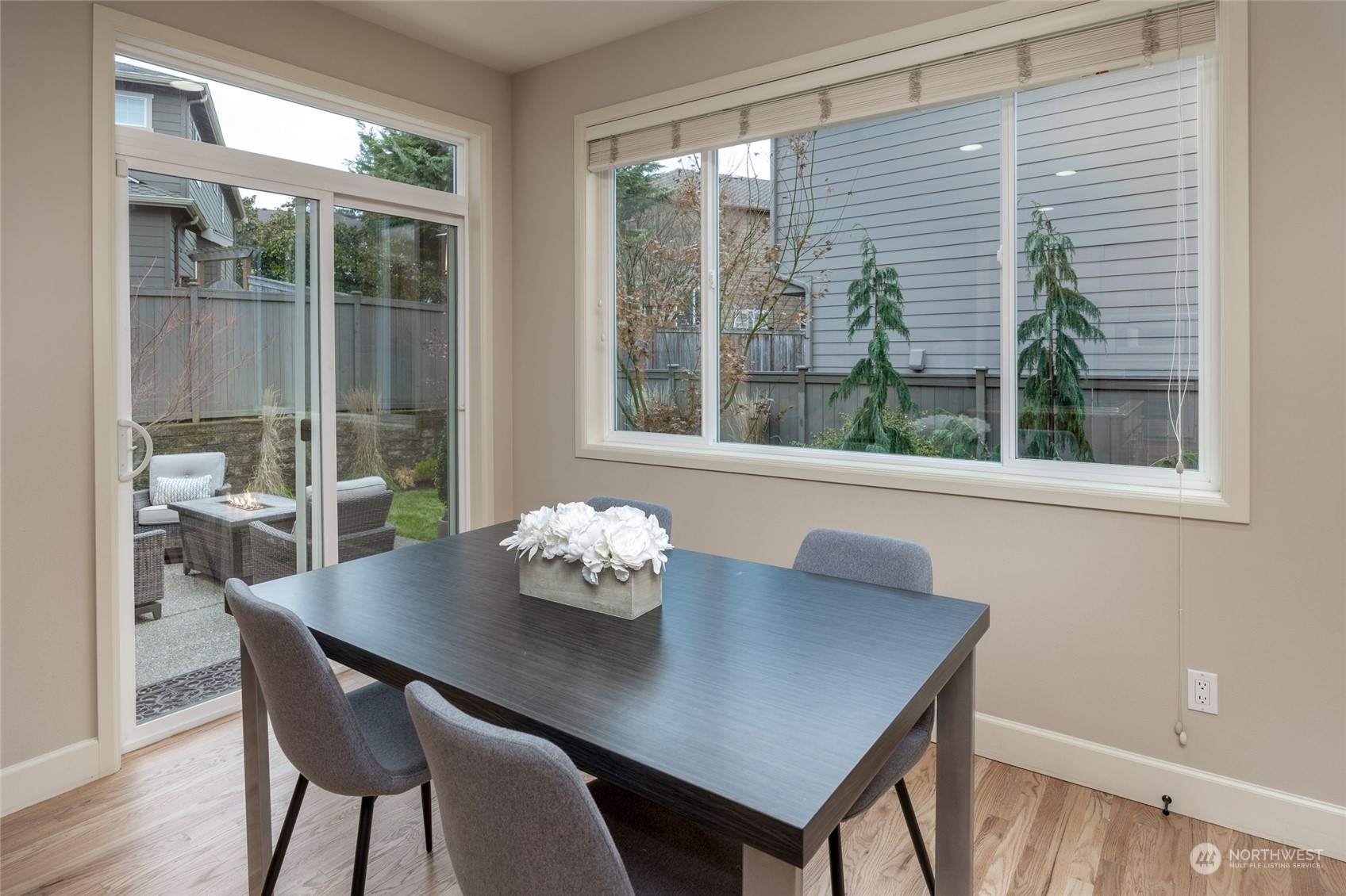 5314 Northeast 17th Place Renton, WA 98059 - Photo 13 of 40 a view of a dining room with furniture wooden floor and a potted plant