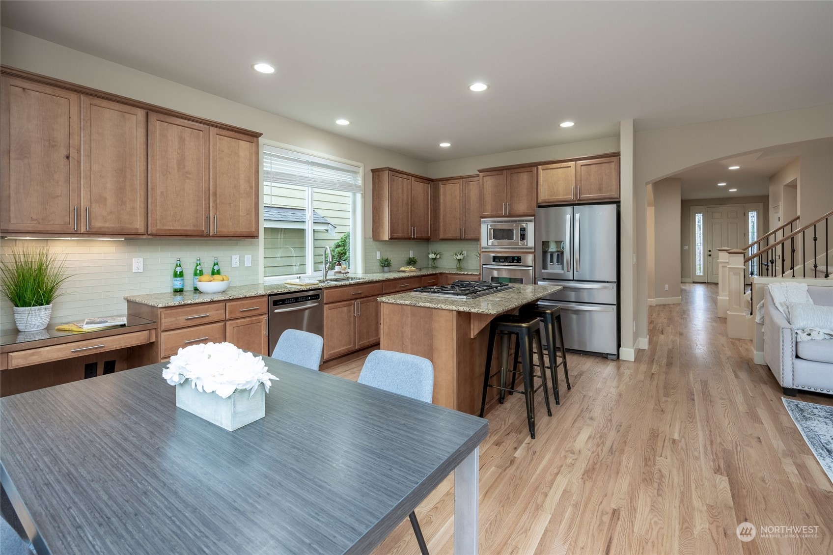 5314 Northeast 17th Place Renton, WA 98059 - Photo 15 of 40 a kitchen with a table chairs a sink and dishwasher