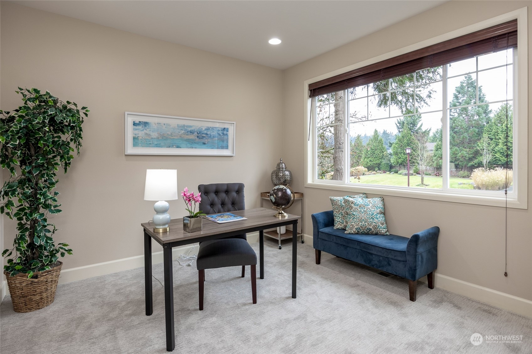 5314 Northeast 17th Place Renton, WA 98059 - Photo 17 of 40 a view of a workspace with furniture and a potted plant