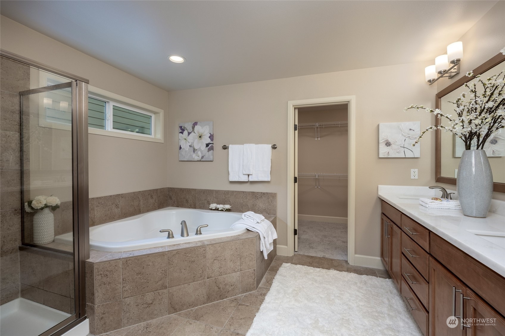 5314 Northeast 17th Place Renton, WA 98059 - Photo 22 of 40 a bathroom with a tub a sink and mirror