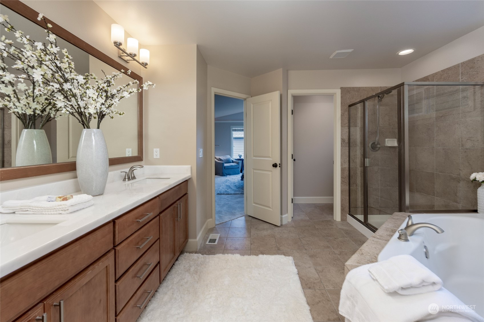 5314 Northeast 17th Place Renton, WA 98059 - Photo 23 of 40 a spacious bathroom with a double vanity sink mirror and shower