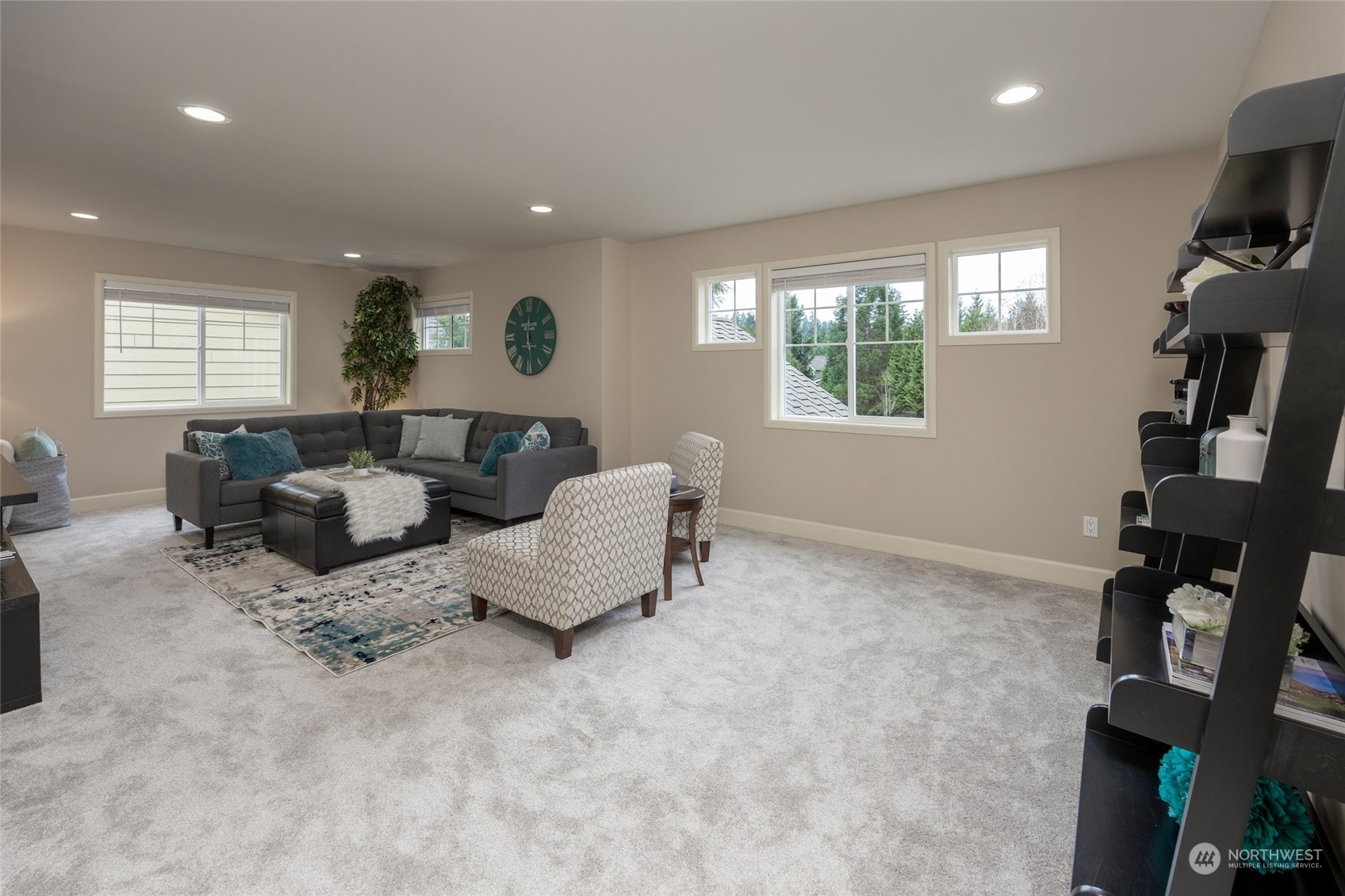 5314 Northeast 17th Place Renton, WA 98059 - Photo 26 of 40 a living room with furniture and a flat screen tv