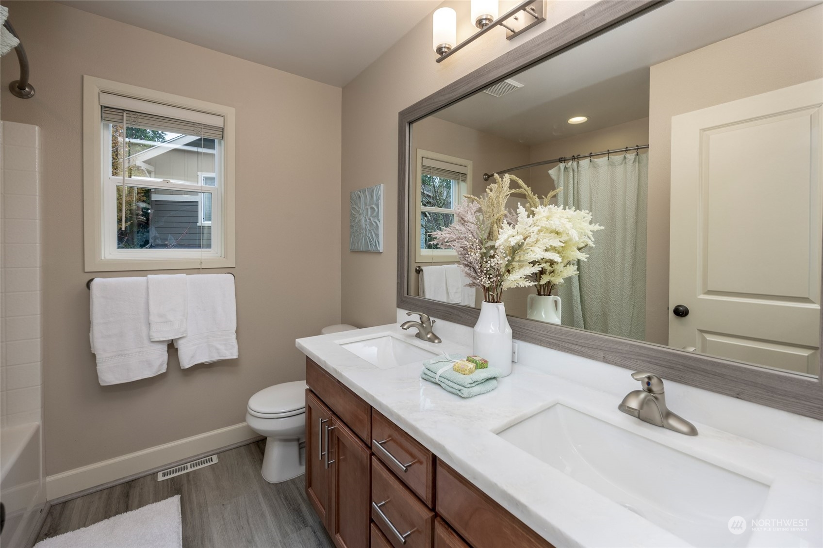 5314 Northeast 17th Place Renton, WA 98059 - Photo 30 of 40 a bathroom with a granite countertop sink mirror and toilet