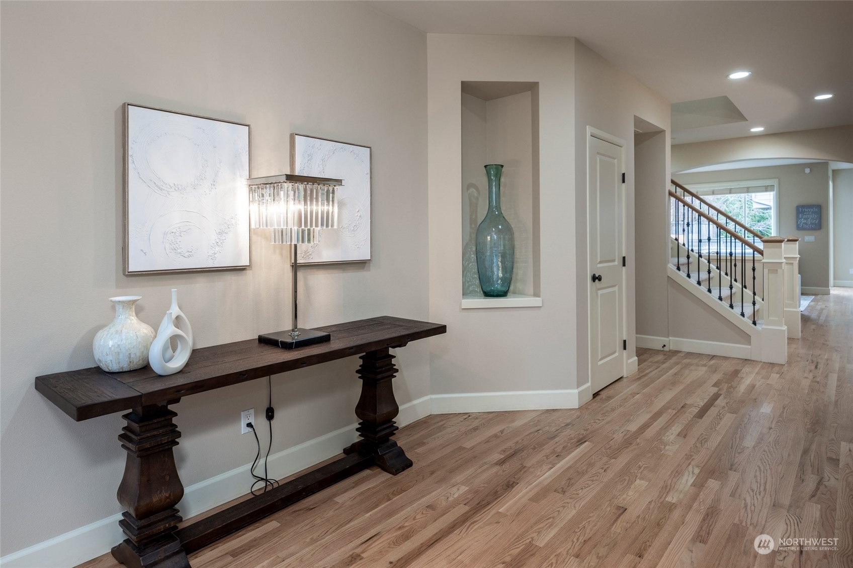 5314 Northeast 17th Place Renton, WA 98059 - Photo 3 of 40 a view of a hallway to room with wooden floor and cabinet