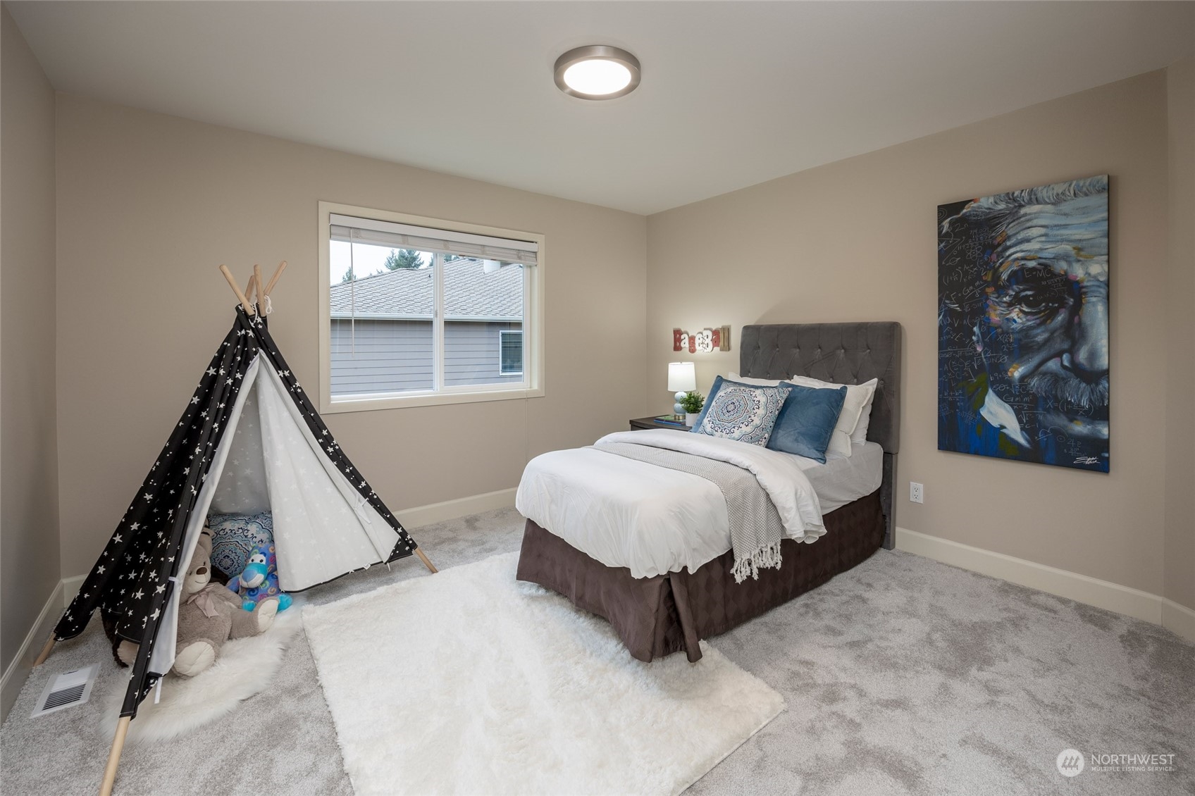5314 Northeast 17th Place Renton, WA 98059 - Photo 32 of 40 a spacious bedroom with a bed and a window