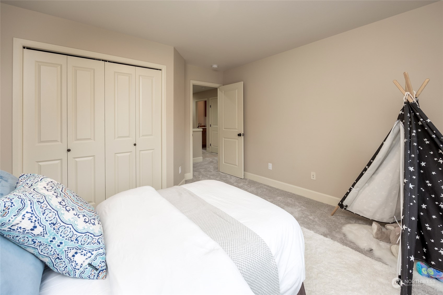 5314 Northeast 17th Place Renton, WA 98059 - Photo 33 of 40 a spacious bedroom with a bed and a dresser